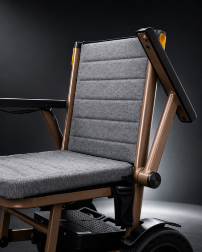 Aeron lightweight folding electric wheelchair with flip up armrests designed for easy access by Etech Mobility