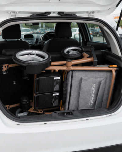 Aeron lightweight folding electric wheelchair stored in small car boot by Etech Mobility