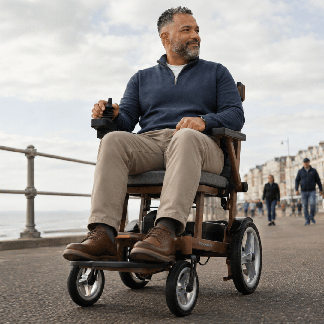 Lightweight, foldable, Aeron aluminium electric wheelchair with 8 inch front wheels and 12 inch wheels by Etech Mobility