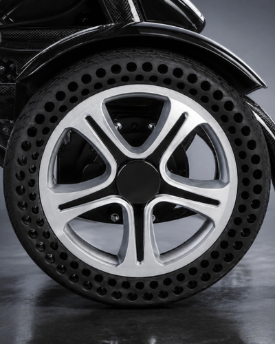 Atlas HD lightweight folding carbon fibre electric wheelchair with solid 12 inch honeycomb wheels by Etech Mobility