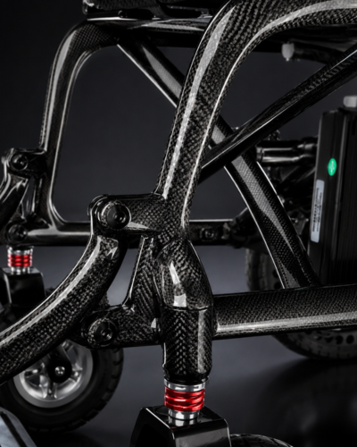 Atlas HD carbon fibre lightweight folding electric wheelchair with carbon fibre weave effect by Etech Mobility
