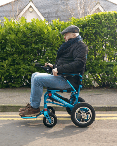 Ultra-lightweight folding, electric wheelchair by Etech Mobility with extended footplate for added comfort and ease on legs