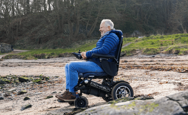 Black folding, lightweight, mulit-terrain electric wheelchair | Etech Mobility