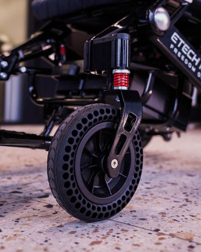 Shock absorbing, honeycomb front dolly wheels designed by Etech Mobility for Freedom Pro and Freedom Elite electric wheelchairs