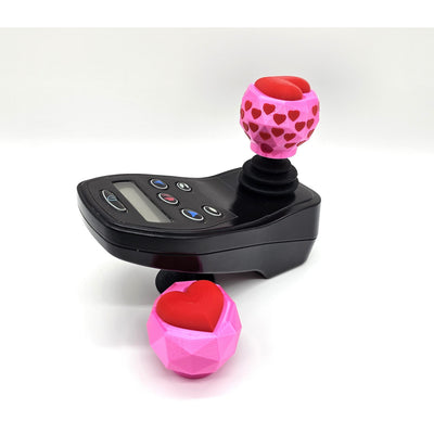 Geo heart joystick topper on an electric wheelchair controller