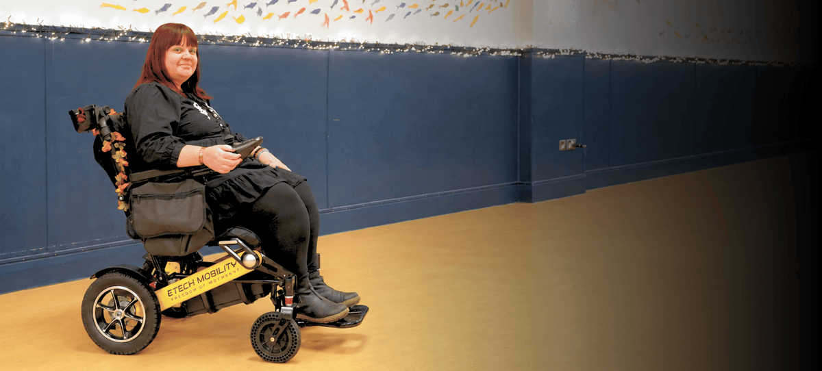 Madeline Moore in a Freedom Pro ST lightweight folding electric wheelchair testimonial video by Etech Mobility