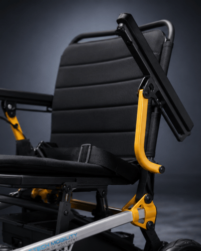 MagNeo compact lightweight folding electric wheelchair with easy access flip up armrests by Etech Mobility