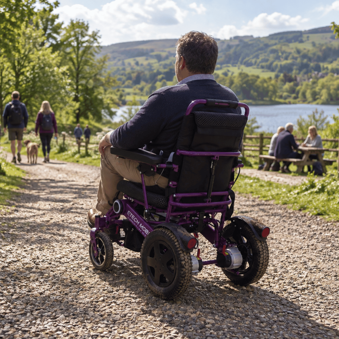 Vanguard 200 lightweight folding electric wheelchair with multi terrain capability due to thick 12 inch rear tyres by Etech Mobility