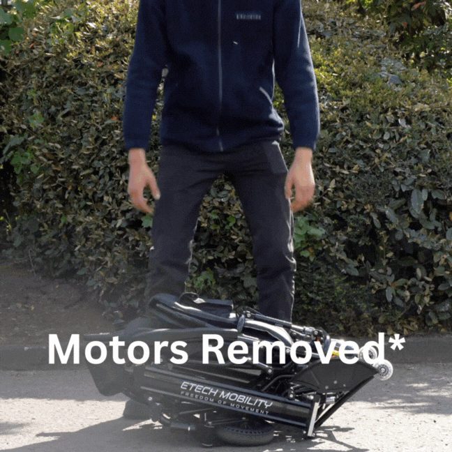 User lifting Y20 Luxe electric wheelchair with the motors removed.